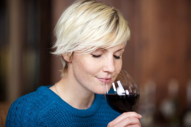 Wine tasting Munich – blonde woman sampling red wine